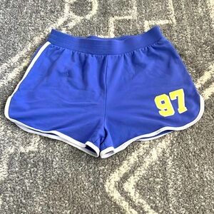 Selling a purple and white pair of No Boundaries running shorts.